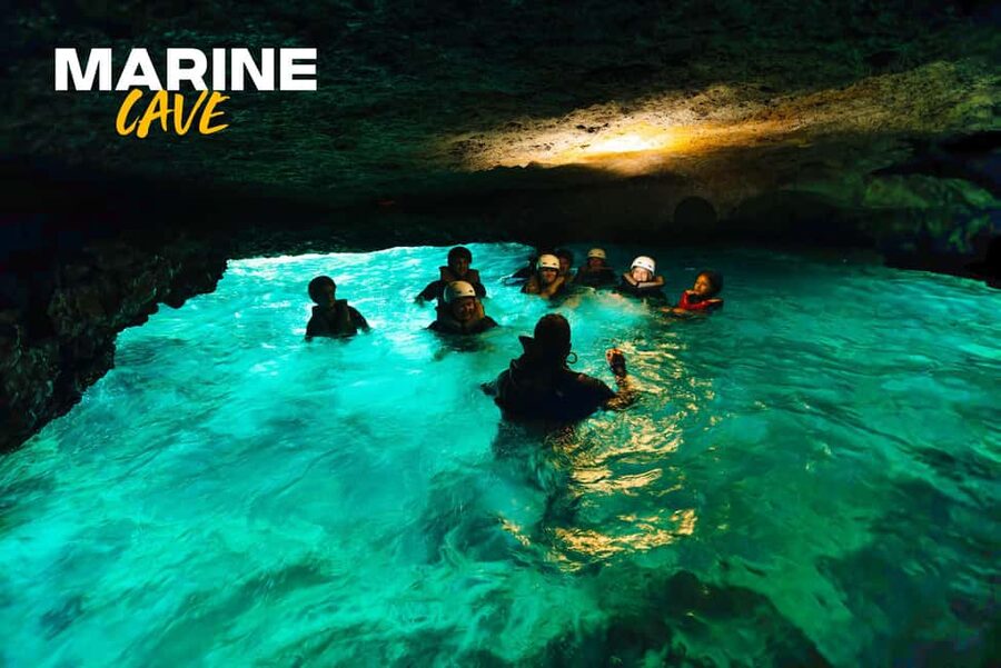 Alcudia: Kayak Tour with Snorkel & Sea Cave Swim - Entering the sea caves
