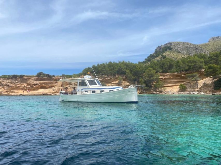 Alcudia: Traditional Wooden Boat Trip with Snorkeling - Following the northern coast toward Cap Menorca