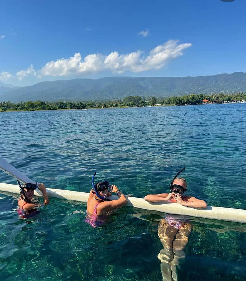 Bali: Lovina Sunset Tour with Snorkeling Experience - Sunset, tea, and the view toward Java