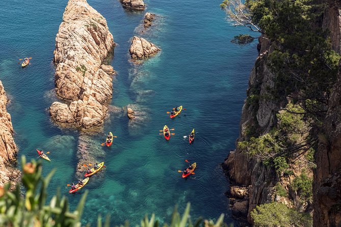 Barcelona Costa Brava Kayak, Snorkel & Cliff Jump Day Tour - Paddling from San Pol beneath the coastal path