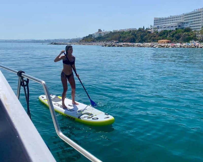 Benalmádena Boat Tour with Snorkeling, Water Slide and Lunch - A small boat, a busy afternoon on the Costa del Sol