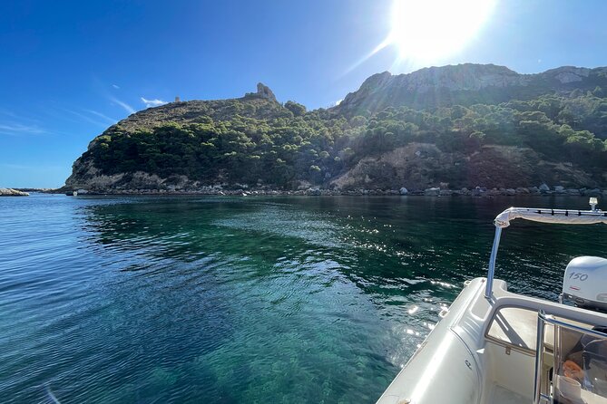 Boat Tour at Devil's Saddle: 4 Swim Stops, Snorkeling & Prosecco - Cala Fighera brings rocky scenery and snorkeling