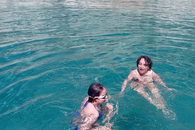 Boat Tour in Cagliari Saddle of the Devil Stops Swimming Snorkeling - The return passes Poetto Beach and the Gulf of Angels