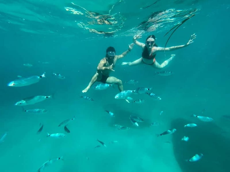 Cagliari: Boat Tour with 4 Swim Stops, Snorkeling & Prosecco - The first swim at Cala Bernat