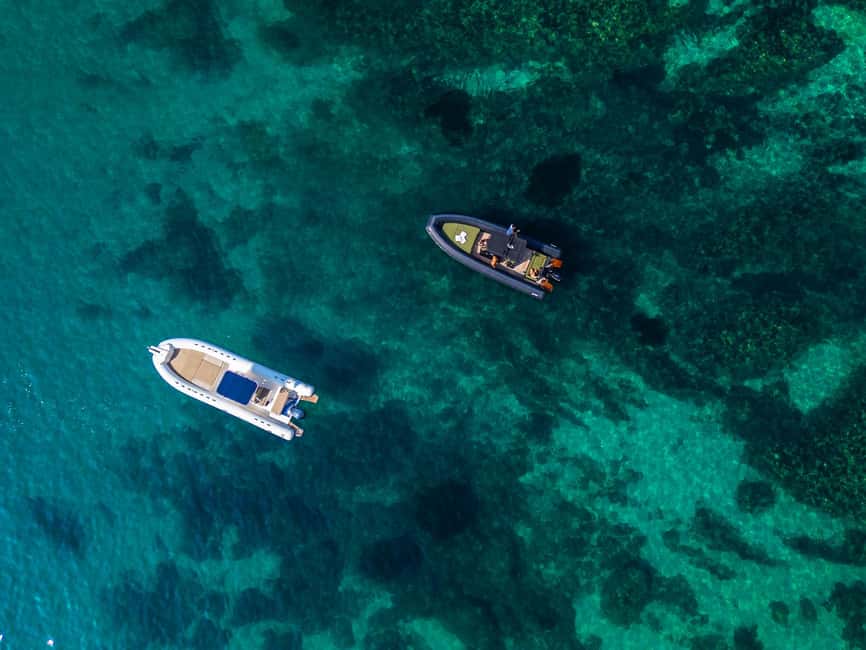 Cagliari: Boat Tour with 5 Snorkeling Stops & Free Drinks - Sella del Diavolo: cliffs, stories, and clear water