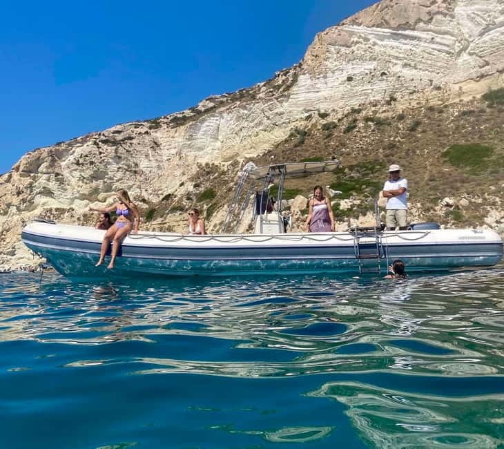 Cagliari: Boat Tour with Snorkeling, GoPro & Sardinian Beer - Leaving Cagliari Port on a compact speedboat