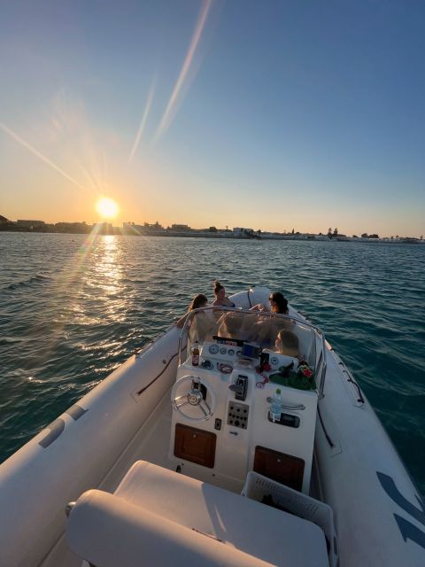Cagliari: tour Sunset snorkeling con aperitivo - Cagliari from the water as the light fades