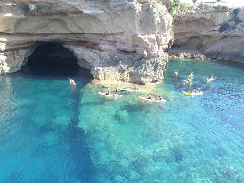 Cala Codolar: Sea & Caves Kayaking Tour with Snorkeling - Snacks, Photos, and the Sunset Choice