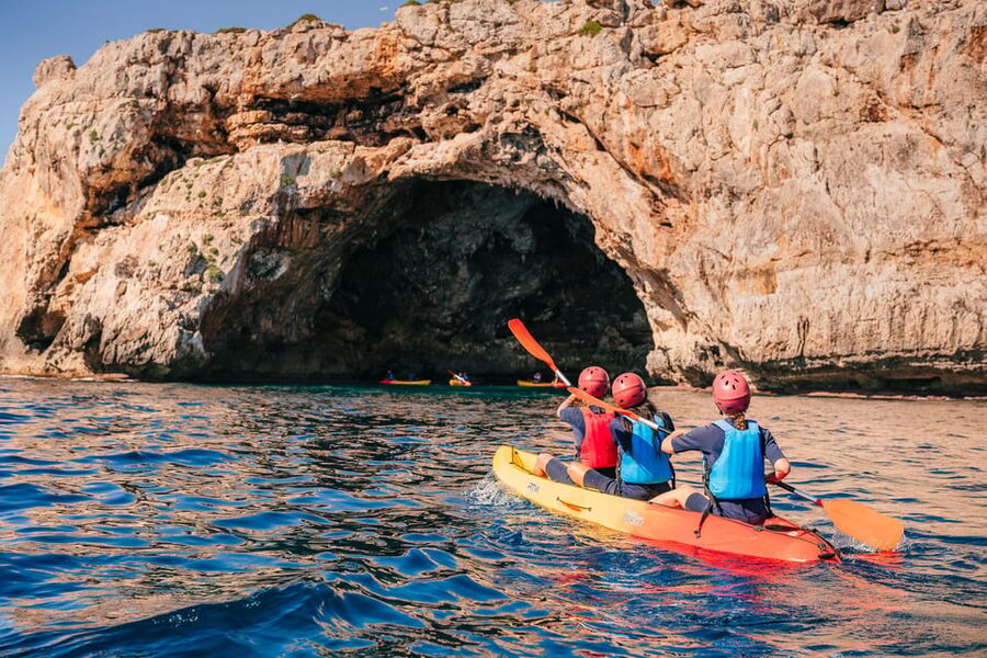 Cala Varques: Guided Sea Caves Kayak & Snorkeling Expedition - Entering Cova des Coloms and the pirate caves