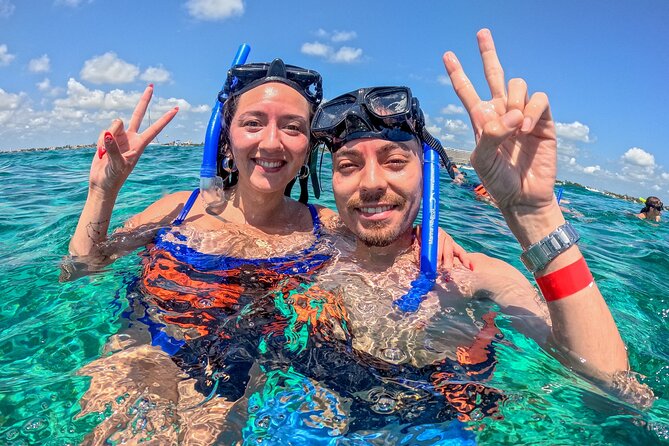 Cancún Catamaran to Isla Mujeres + Snorkel, Open Bar & Lunch - Snorkeling in the Cancun waters