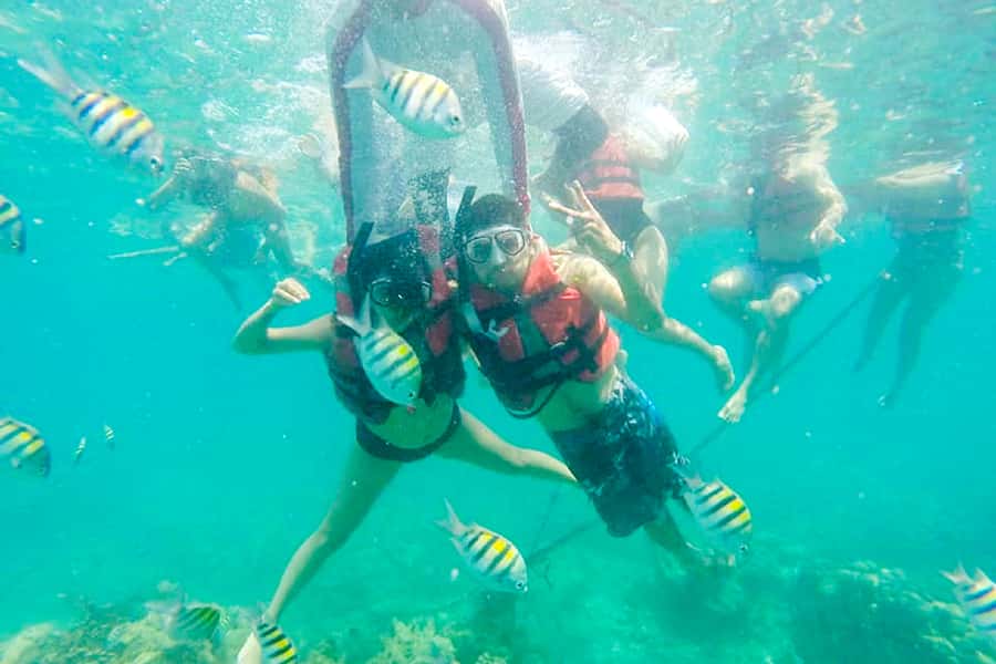 Cartagena: Snorkel, Mangroves and Playa Blanca Tour - Boarding the boat near Playa Blanca