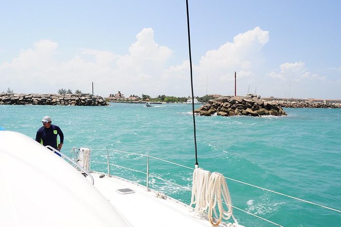 Catamaran Sail and Snorkeling Tour with Open Bar in Puerto Morelos - Open bar, crew service, and the mood onboard