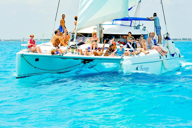 Catamaran to Isla Mujeres Snorkeling Tour with Open Bar and Lunch - The return sailing and sunset appeal