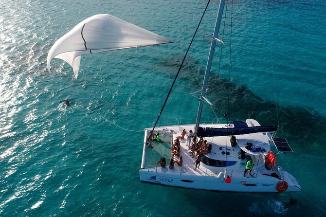 Catamaran Tour to Isla Mujeres, Open bar, Lunch, Snorkeling, Beach Club Included - What the seven-hour day is really like