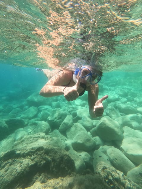 Chania: Boat Trip with Guided Snorkeling Tour - Fruit, water, and a useful pause between swims