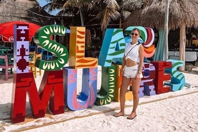 Deluxe Catamaran to Isla Mujeres, with Drinks, Snorkel & Buffet - Unlimited drinks and a lively crew