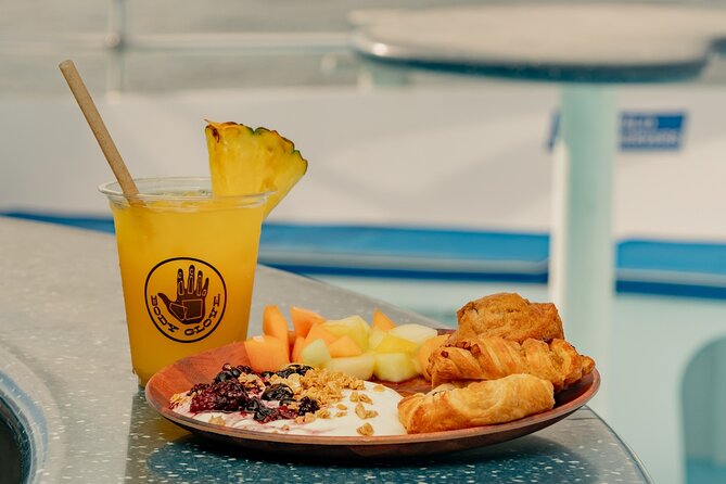 Deluxe Snorkel & Dolphin Watch Aboard a Luxury Catamaran from Kailua-Kona - Dolphin watching along the Kona Gold Coast