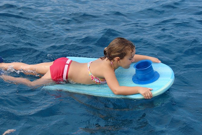 Deluxe Snorkel & Dolphin Watch Aboard a Luxury Catamaran from Kailua-Kona - Slides, jump platforms, and floating toys