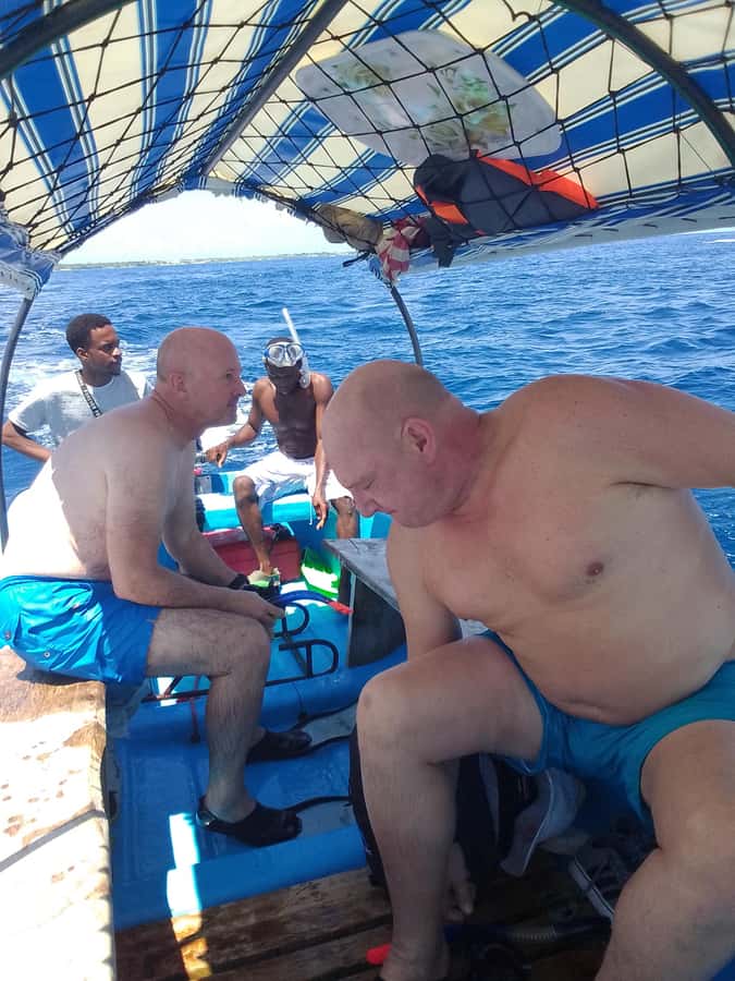 Dolphins & Snorkeling Zanzibar: Mnemba Island Tour - Fruit, water, and a quiet half-hour
