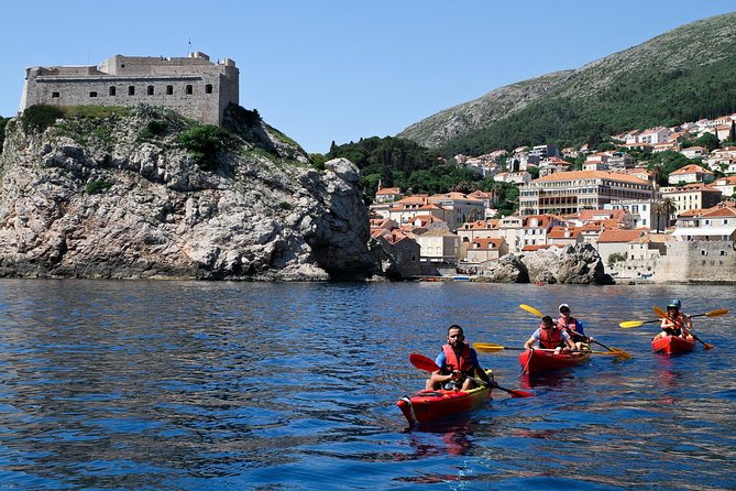 Dubrovnik: Sunset Kayaking & Snorkeling with water &wine - Paddling past Dubrovnik’s sea walls
