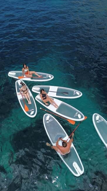 Experience Crystal paddle surf Tours + snorkel - A calm lesson before the paddling begins