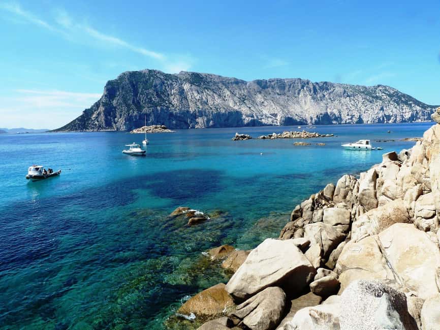From Olbia: Dinghy Tour with Snorkeling to Tavolara Island - Tavolara beneath its limestone cliffs