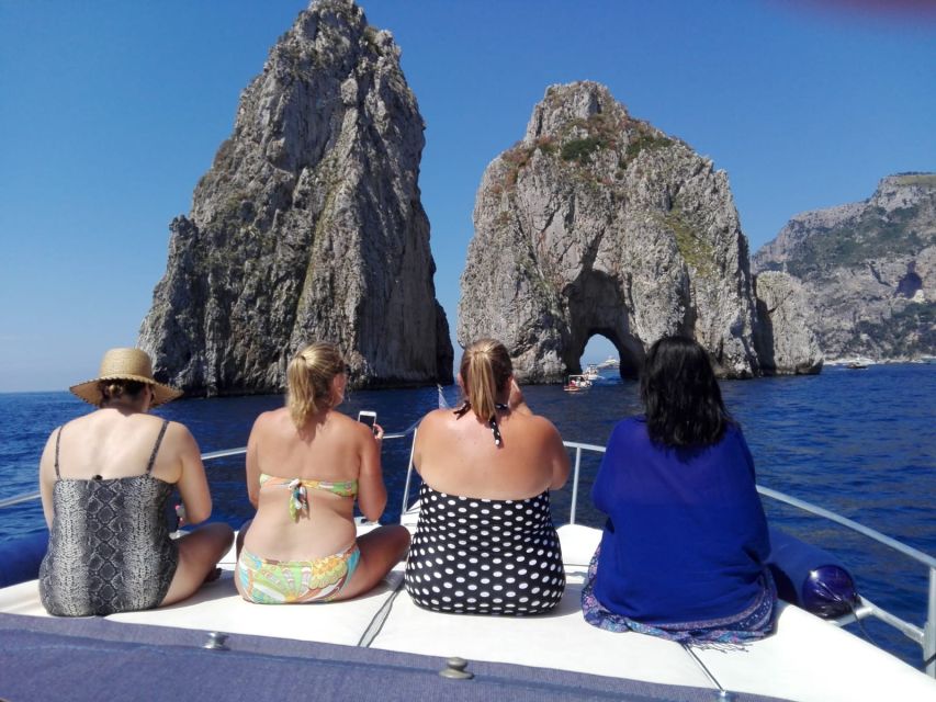 From Sorrento: Capri Boat Trip with Snorkeling and Drinks - The Faraglioni tunnel and the final swim