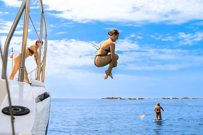 Half Day Cabo Snorkel Adventure with Lunch and Open Bar - Boarding the catamaran in Cabo San Lucas