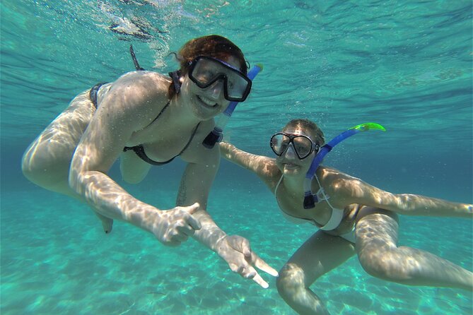 Ibiza Snorkeling Beach and Cave Tour - Drinks, music, and the boat atmosphere