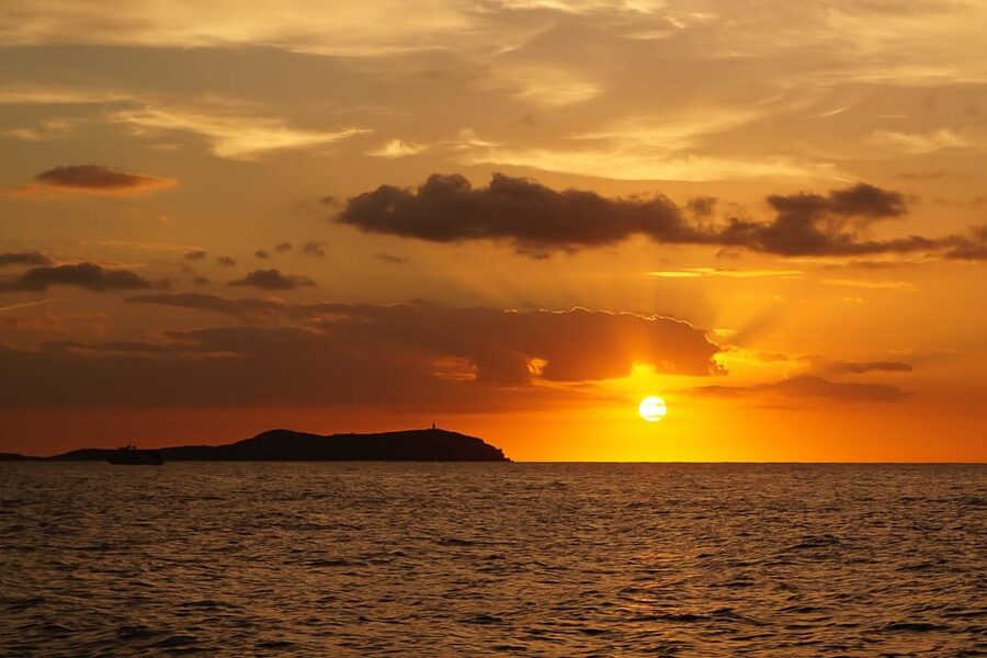 Ibiza: Sunset Boat Trip with Snorkeling, Kayaking, & Drinks - Leaving San Antonio beside the egg