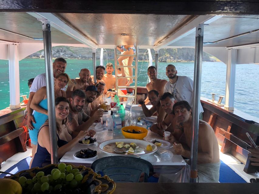 Ischia: Island Boat Tour with Neapolitan Lunch & Snorkeling - Sant’Angelo brings the first real pause