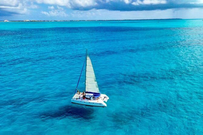 Isla Mujeres: Catamaran Tour with Snorkeling Food, Drinks, Beach - The spinnaker flight and weather limits