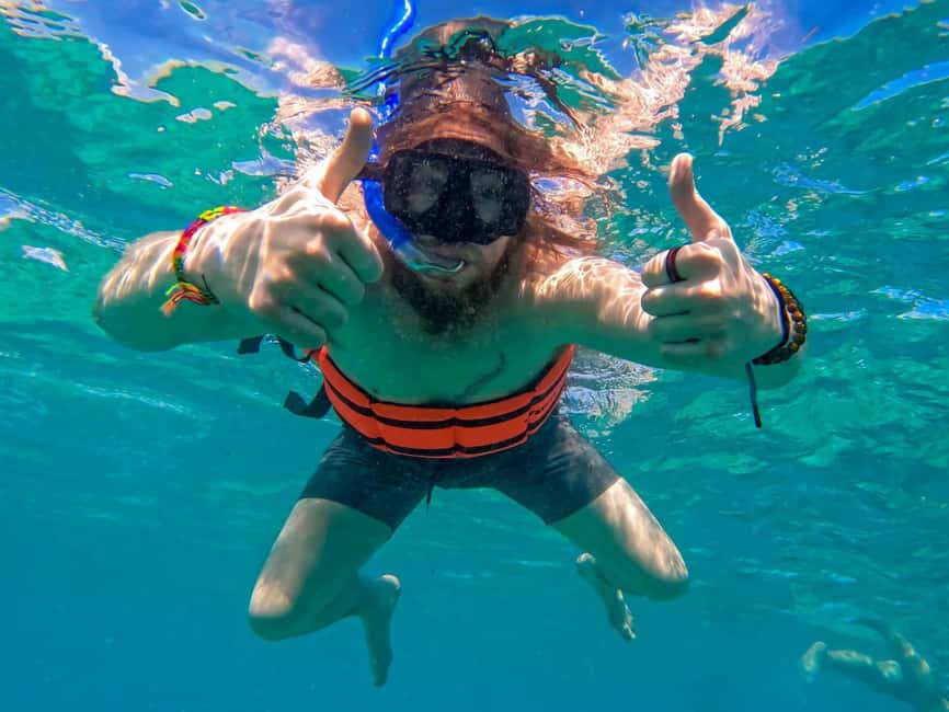 Isla Mujeres Catamaran Tour with Snorkeling & Open bar - Open bar, music, and the trip back