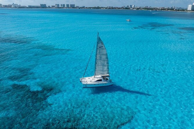 Isla Mujeres Day Tour with Catamaran, Snorkeling & Beach Club - Sailing toward Bahia Mujeres