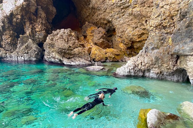 Kayak Paradise: Cala Portixol Snorkel, Cave & Cliff Jumping Tour - The blue lagoon and optional cliff jumping