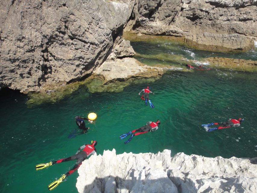 Lisbon: Snorkelling in Sesimbra/Arrábida Natural Park - Entering the water in a calm marine park