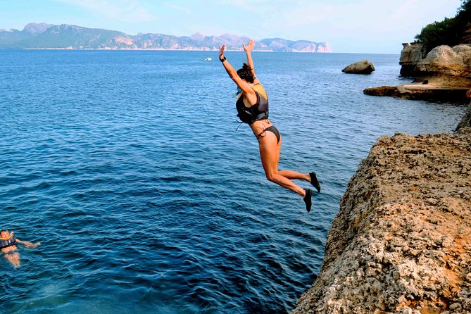 Mallorca: Kayaking, Sea Cave, Cliff Jumping & Snorkel Tour - Cliff jumping, with no pressure to jump