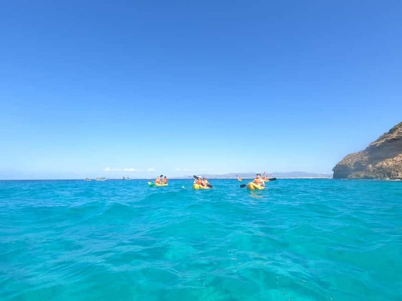 Mallorca: Sea Caves Kayaking Tour, Snorkeling & Snack - Paddling beside the southern cliffs