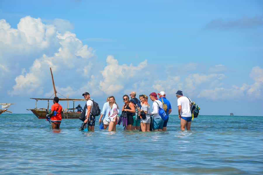 Matemwe: Mnemba Island Dolphin & Snorkeling Boat Trip - The dhow, crew, and group atmosphere