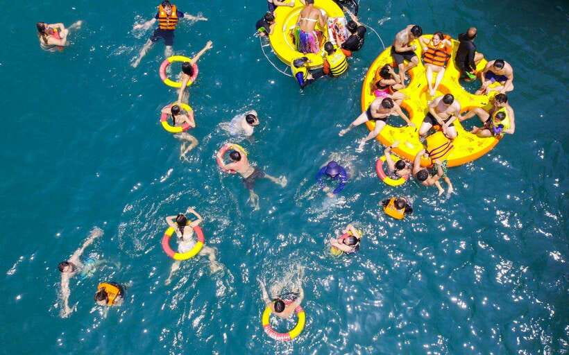 Nha Trang: Hopping Tour, Snorkeling, Boat Party, & BBQ Lunch - The floating party, boat slide, and water time