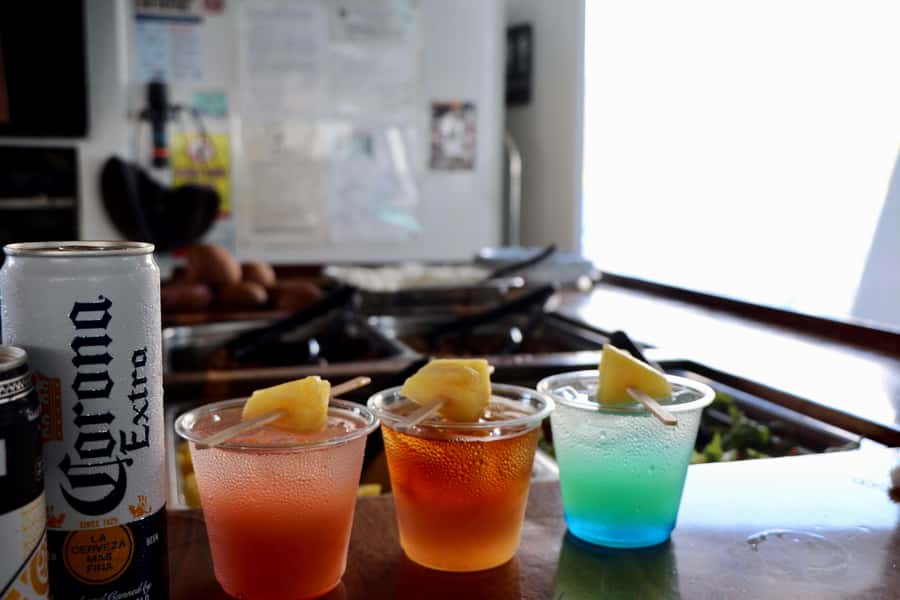 Oahu: Snorkeling & Dolphin Watch Cruise w/ Luau Style Buffet - Relaxing on the boat between activities