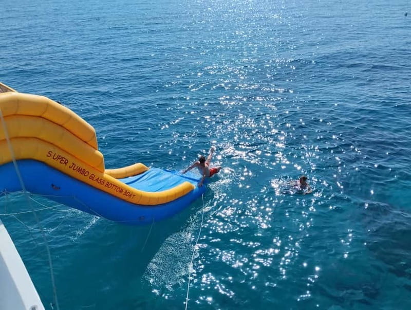 Paphos: Glass Bottom Boat Trip with Swimming or Snorkeling - The slide and jump belong to the longer cruise