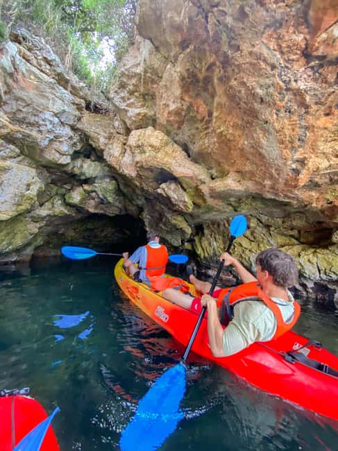 Pula: Cave Kayak Tour, Snorkeling and Island Jumping - Paddling along Pula’s rocky coast
