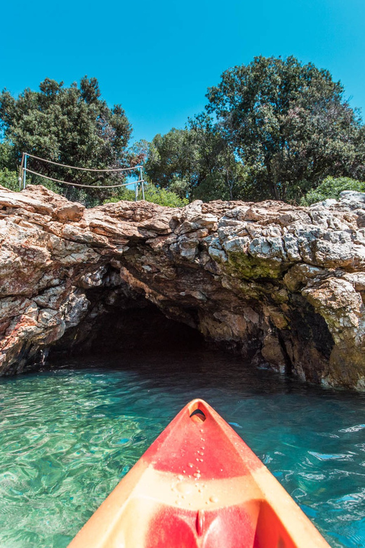 Pula: Kayak Adventure with Cave & Island Snorkeling - Passing Fratarski Otok by kayak