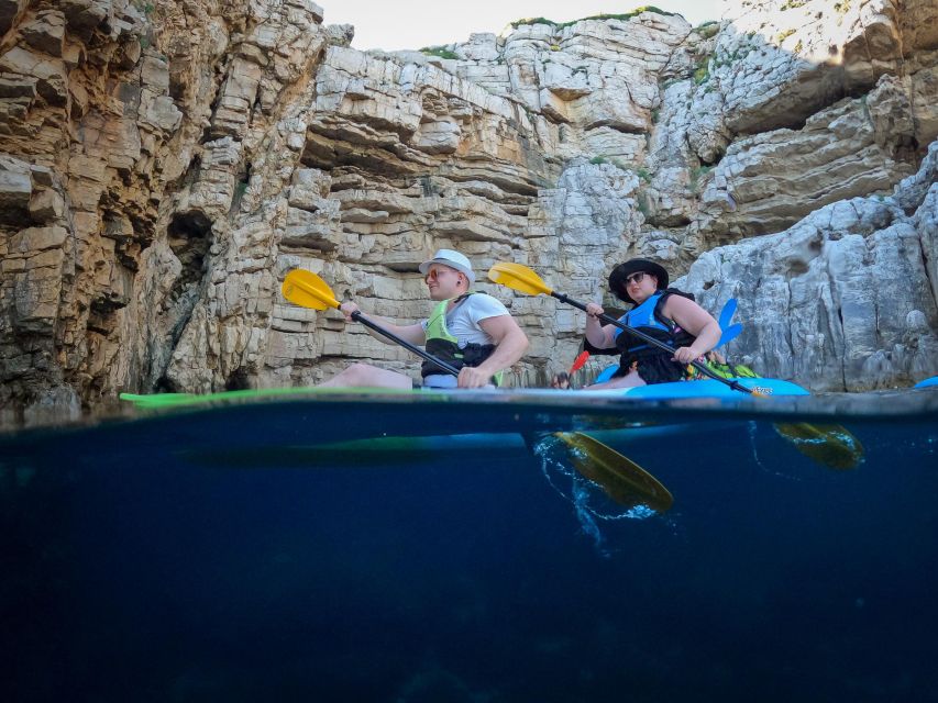 Pula: Kayaking,Snorkeling, Cliff jumping Tour with Wetsuit - Cliff jumping with a guide nearby
