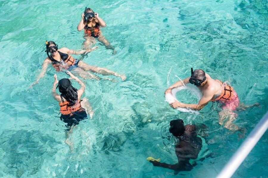 Punta Cana: Catamaran Tour with Reef Snorkeling and Open Bar - The natural pool: shallow water and drinks in hand