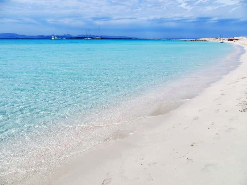 San Antonio: Es Vedrà & Formentera Boat Tour with Snorkeling - Paella cooked on the boat