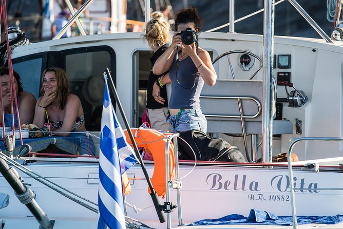 Santorini Adventurous Catamaran Experience with Snorkeling - The Akrotiri lighthouse and southern cliffs