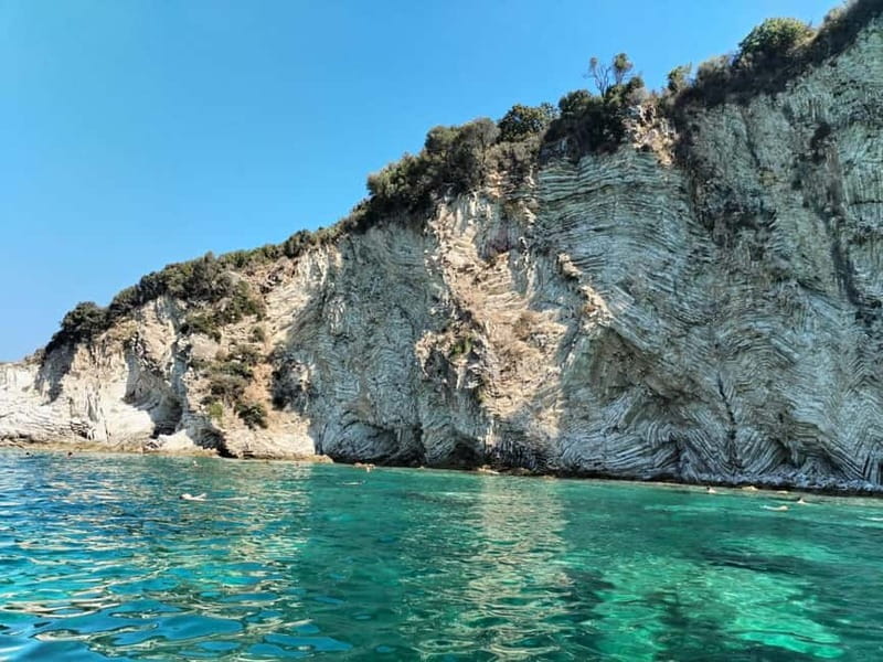 Sarandë:Boat Tour to Kroreza with snorkelling & umbrellas - The first swimming stops: Gremina Bay and Qefal