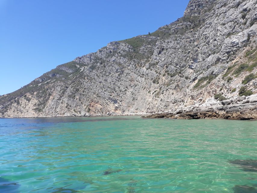 Sesimbra: Secret Bays and Beaches Boat Tour with Snorkeling - Cova Beach sets the tone